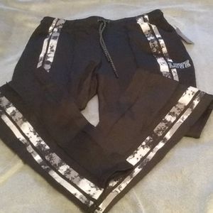 Jogger pants with snake pattern stripe detail.